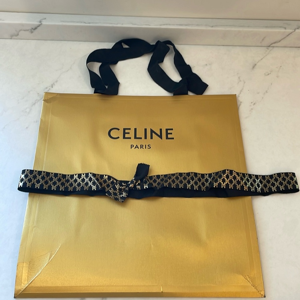 Celine gold shopper and gold and black logo ribbon
